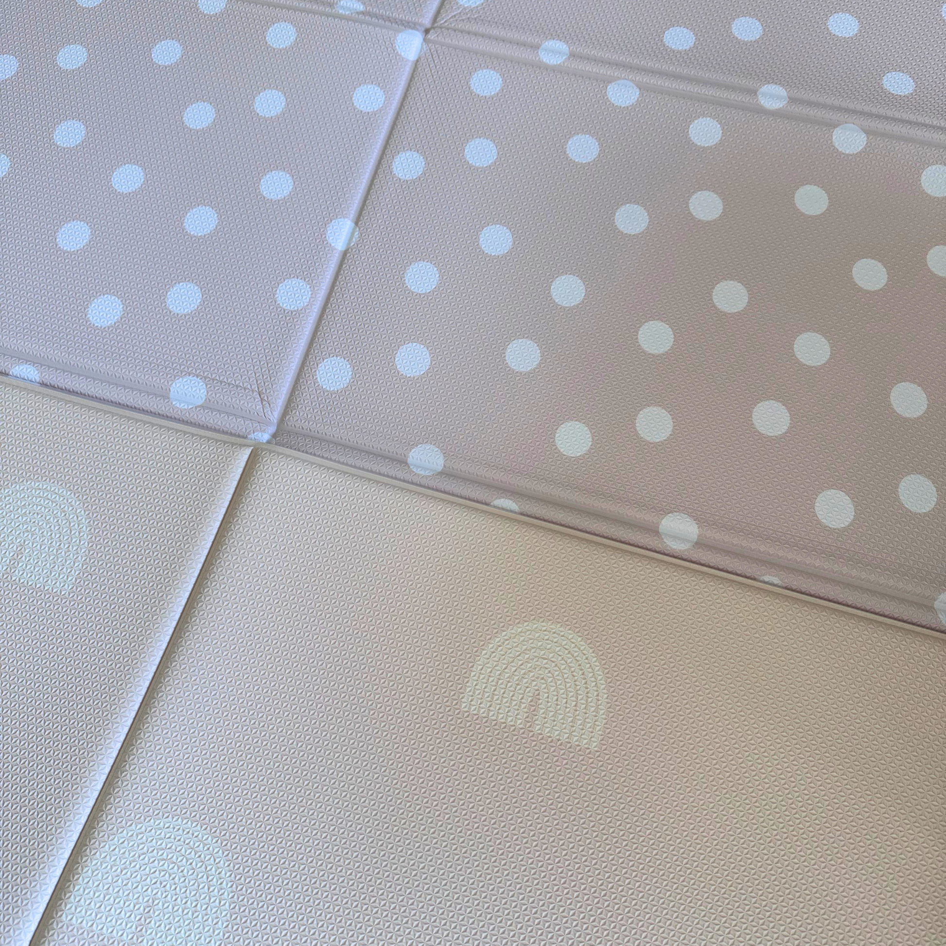 The Rainbow & Dot Foldable Playmat from Plush Playmats